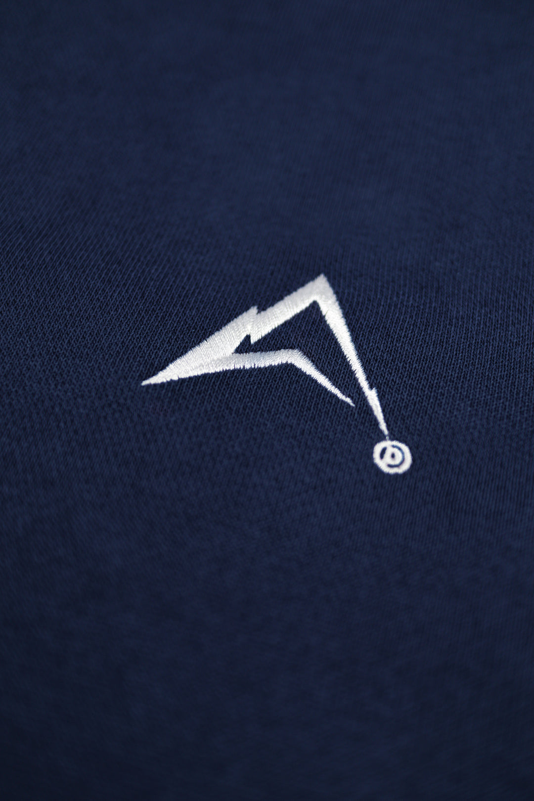 White logo on a navy blue background