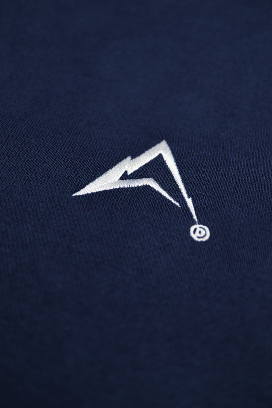 White logo on a navy blue background