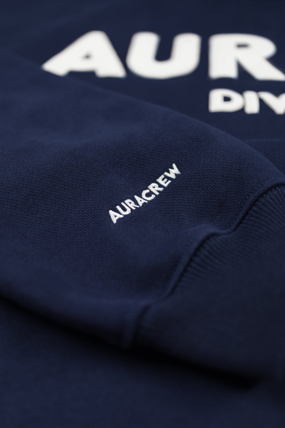 AURACREW Emroided on the ACT 2 Navy Blue Hoodie Sleeve
